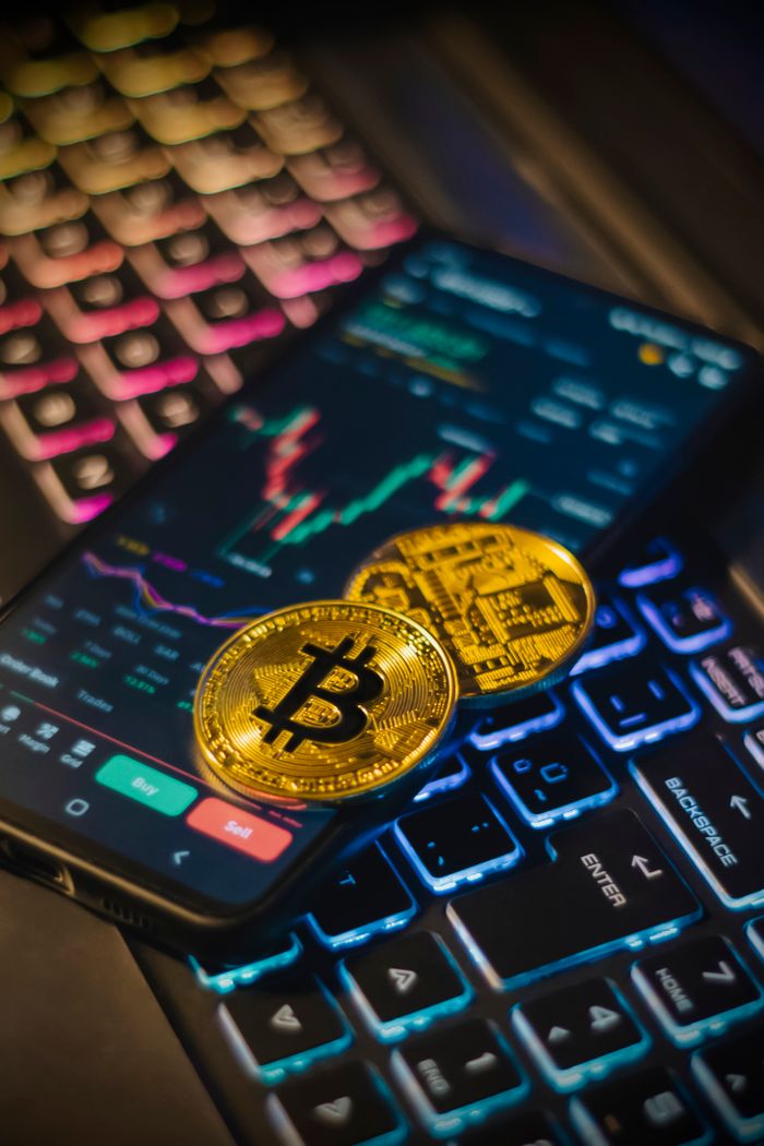The Art of Drawing Readers In: Your attractive post title goes here Colorful keyboard with Bitcoin coins and trading screen for crypto analysis.
