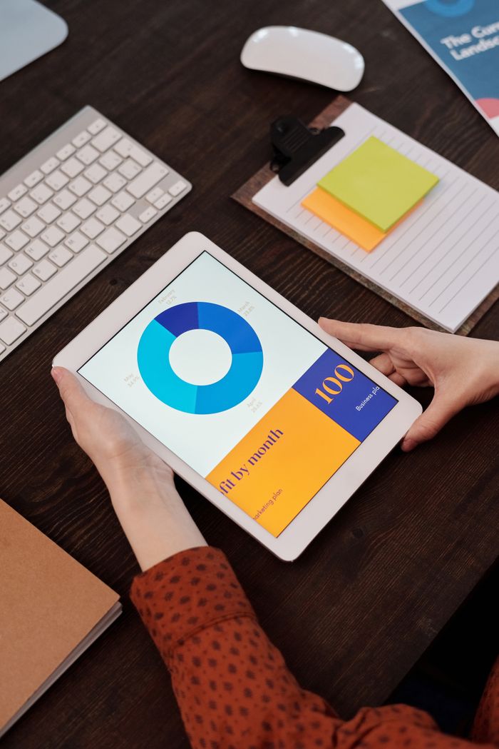 Services Modern office setting featuring a digital tablet displaying a graph, perfect for business presentations.